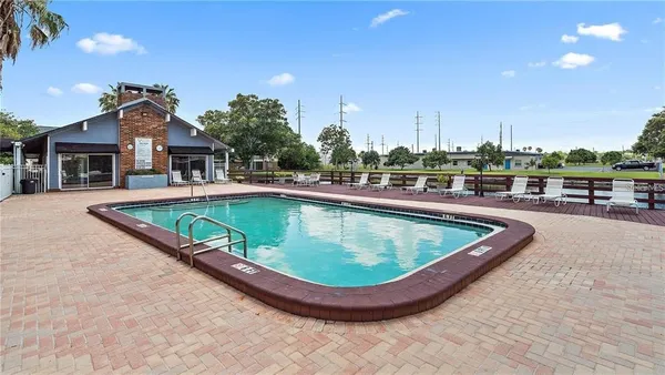 a view of a swimming pool with a terrace