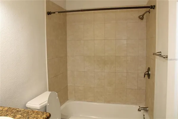 a bathroom with a bathtub and shower