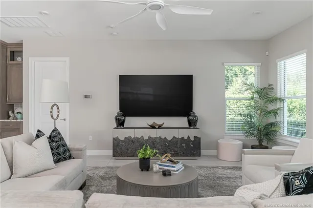 a view of entryway with wooden cabinet and stairs