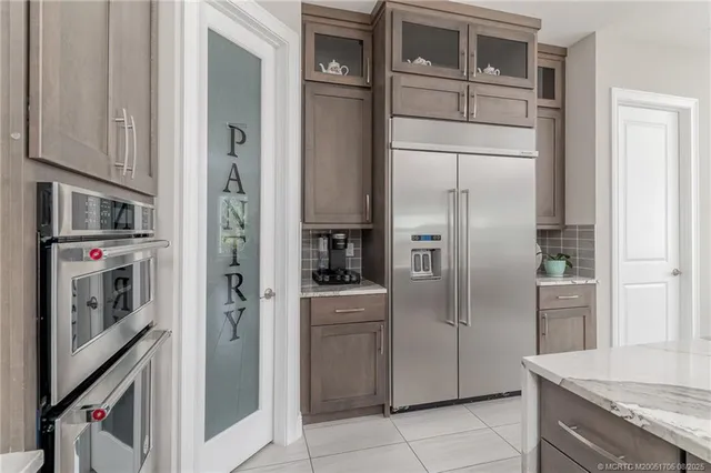 a bedroom with a large bed and a flat screen tv