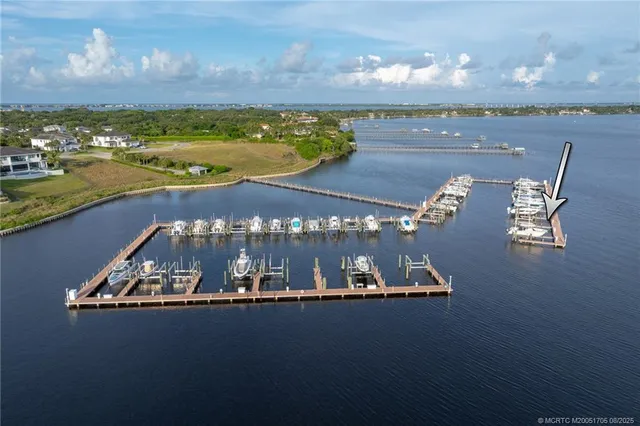 an aerial view of a house with a lake view