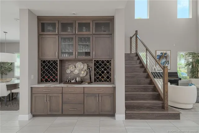 a spacious bedroom with a bed and a flat screen tv