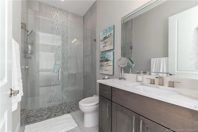 a en suite bathroom with a tub sink and mirror