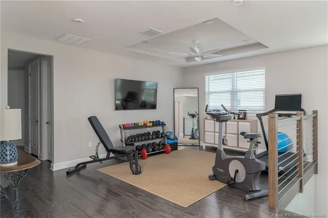 a view of a livingroom with workspace and a window