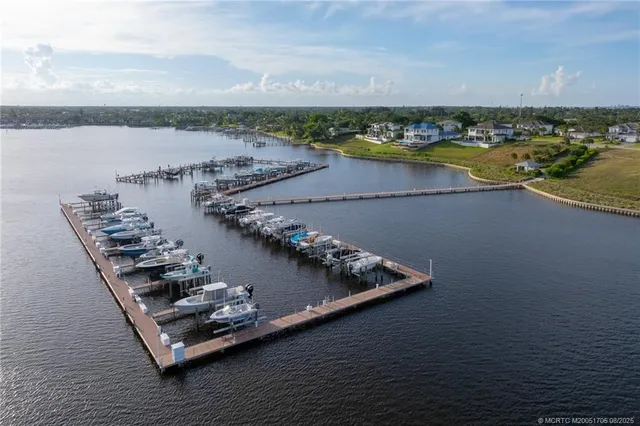 an aerial view of a house with swimming pool garden and patio