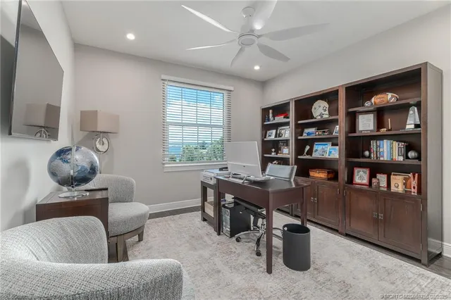 a view of swimming pool with outdoor seating and a patio