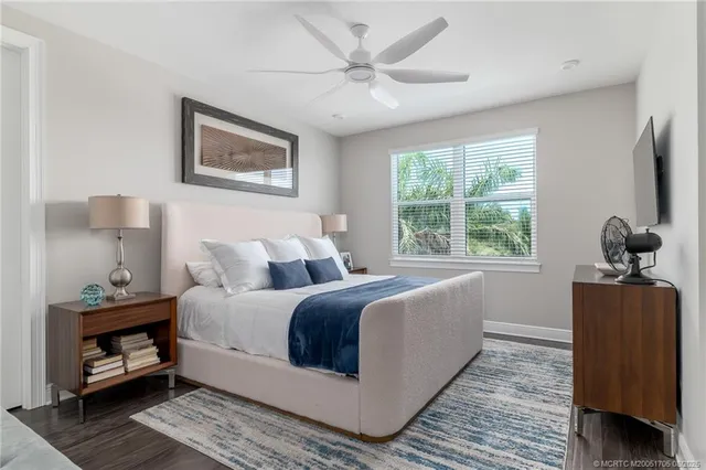 a living room with furniture a table and chairs