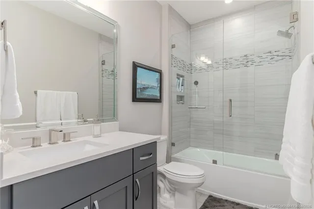 a view of a swimming pool with chair and table