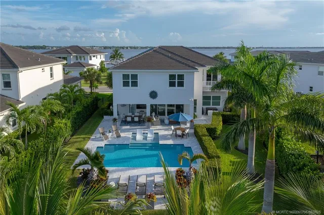 a view of a swimming pool with chairs