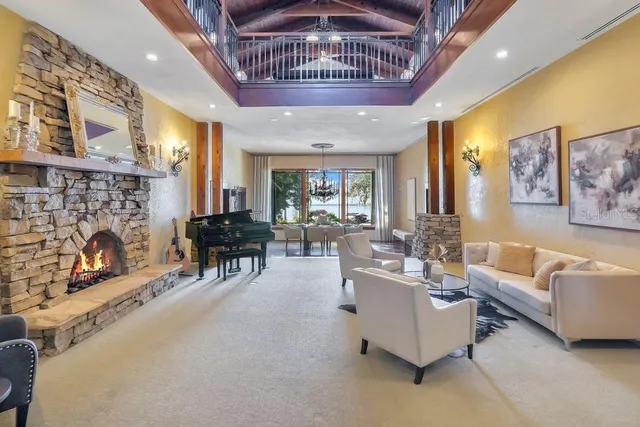 a kitchen with stainless steel appliances granite countertop a stove a sink a oven a dining table and chairs