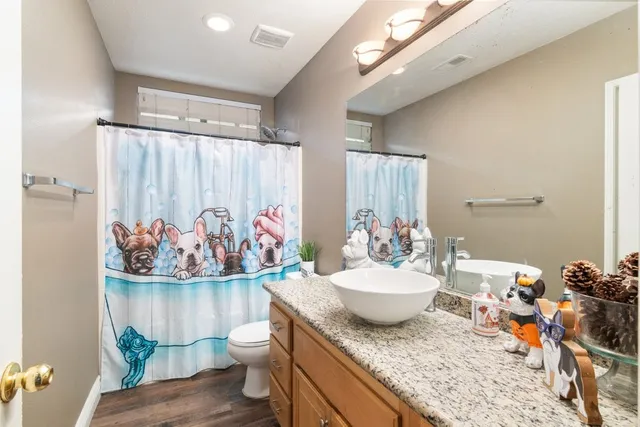 a view of a very nice looking dining room with a table and chairs
