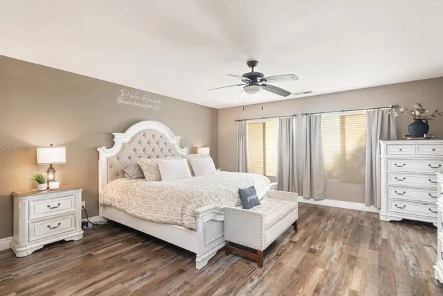 a bedroom with a bed and a dresser