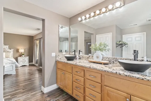 a kitchen with sink and cabinets