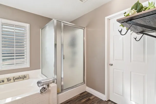 a bathroom with a shower and a sink