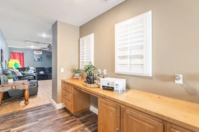 a kitchen with a sink cabinets and window