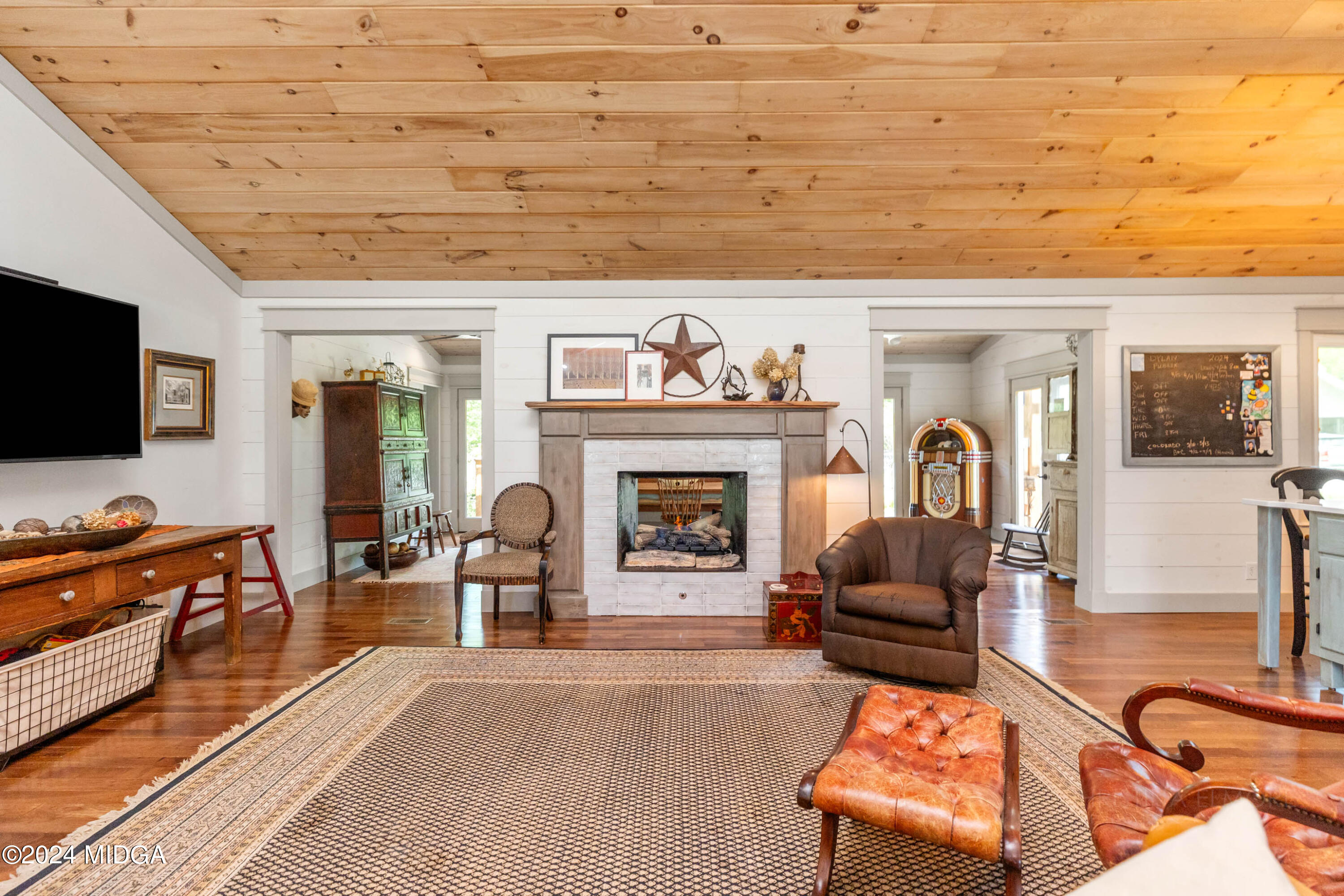 362 Stone Edge Road Macon, GA 31210 - Photo 13 of 68 a living room with furniture a flat screen tv and a fireplace