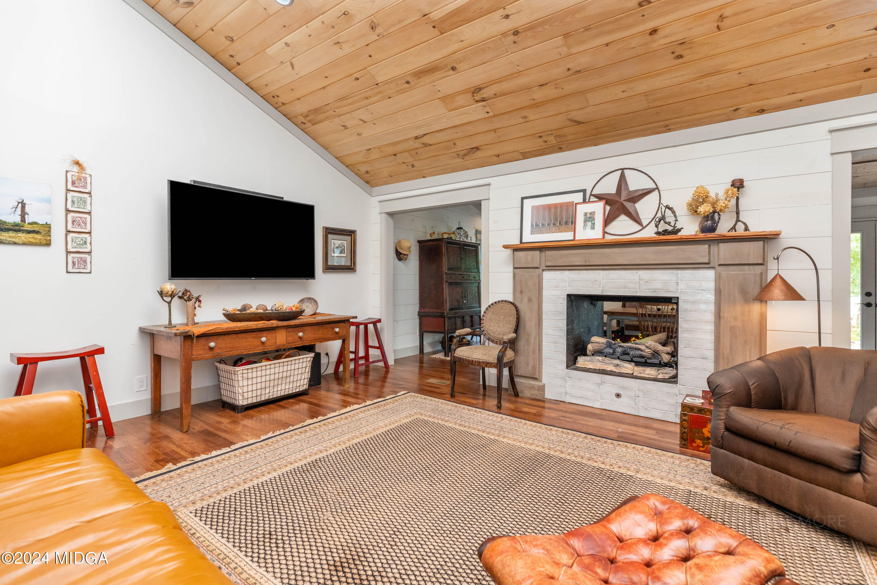 362 Stone Edge Road Macon, GA 31210 - Photo 14 of 68 a living room with furniture and a flat screen tv