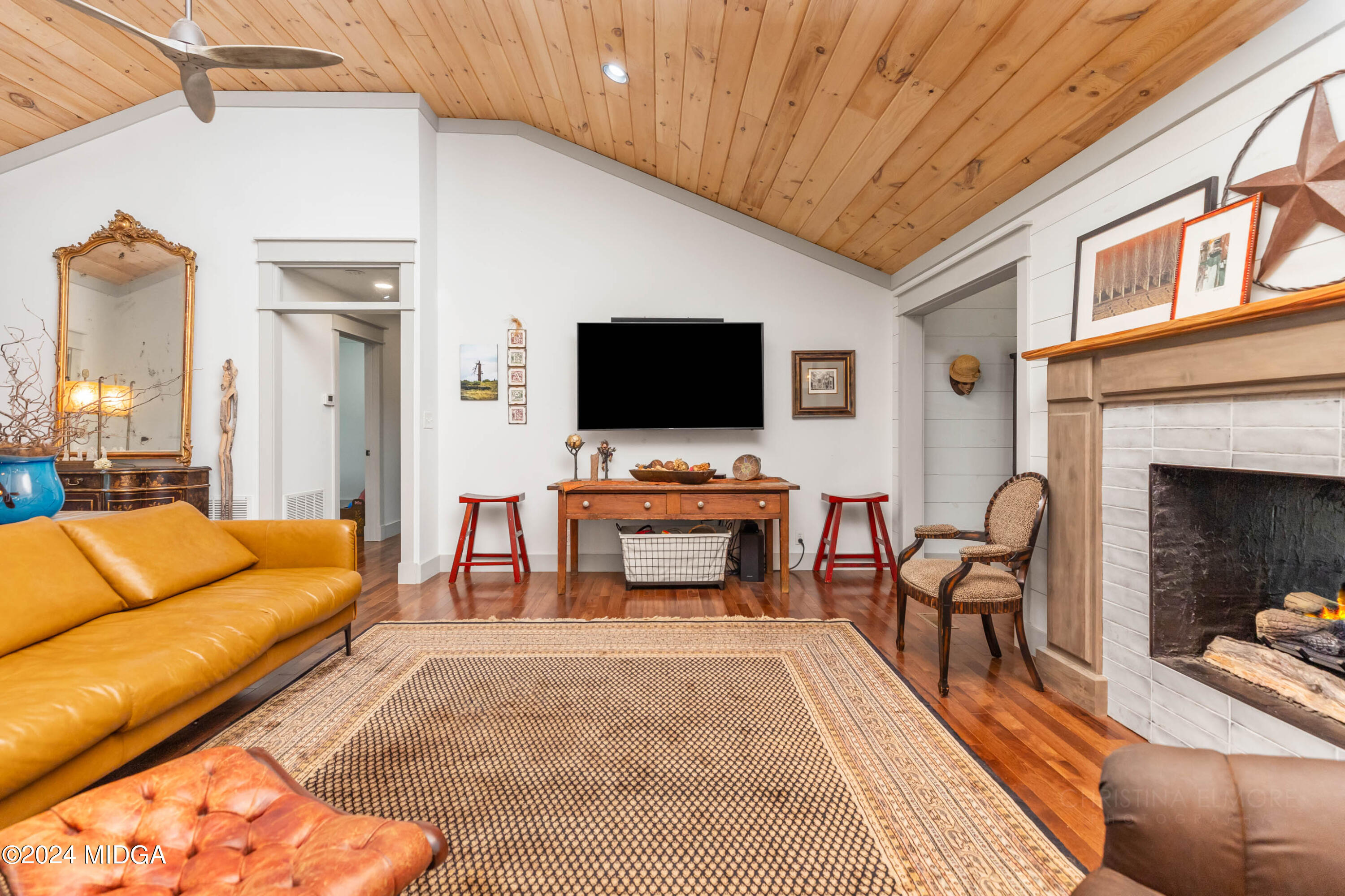 362 Stone Edge Road Macon, GA 31210 - Photo 18 of 68 a living room with furniture a fireplace and a flat screen tv