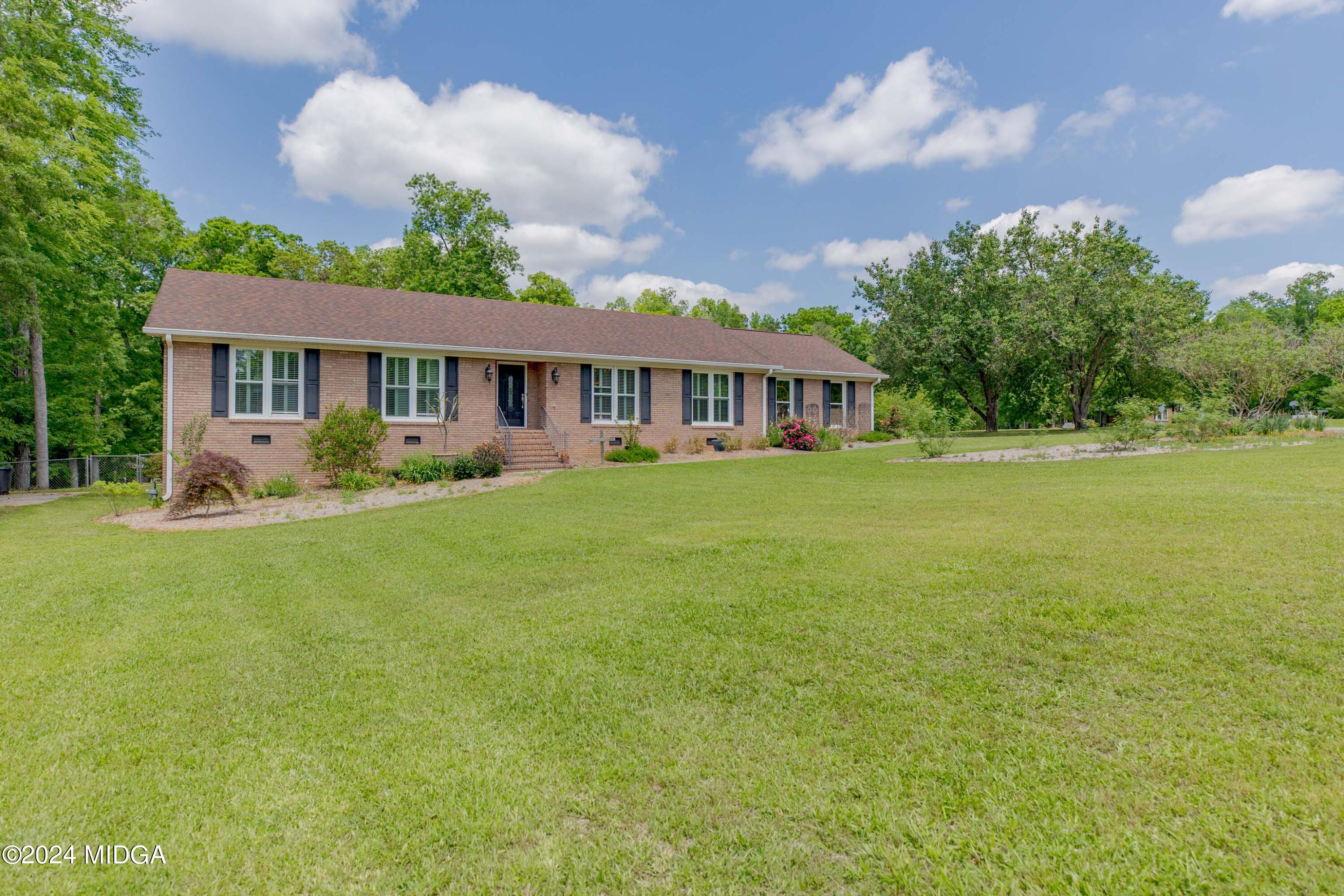 362 Stone Edge Road Macon, GA 31210 - Photo 2 of 68 a view of a house with a big yard and potted plants