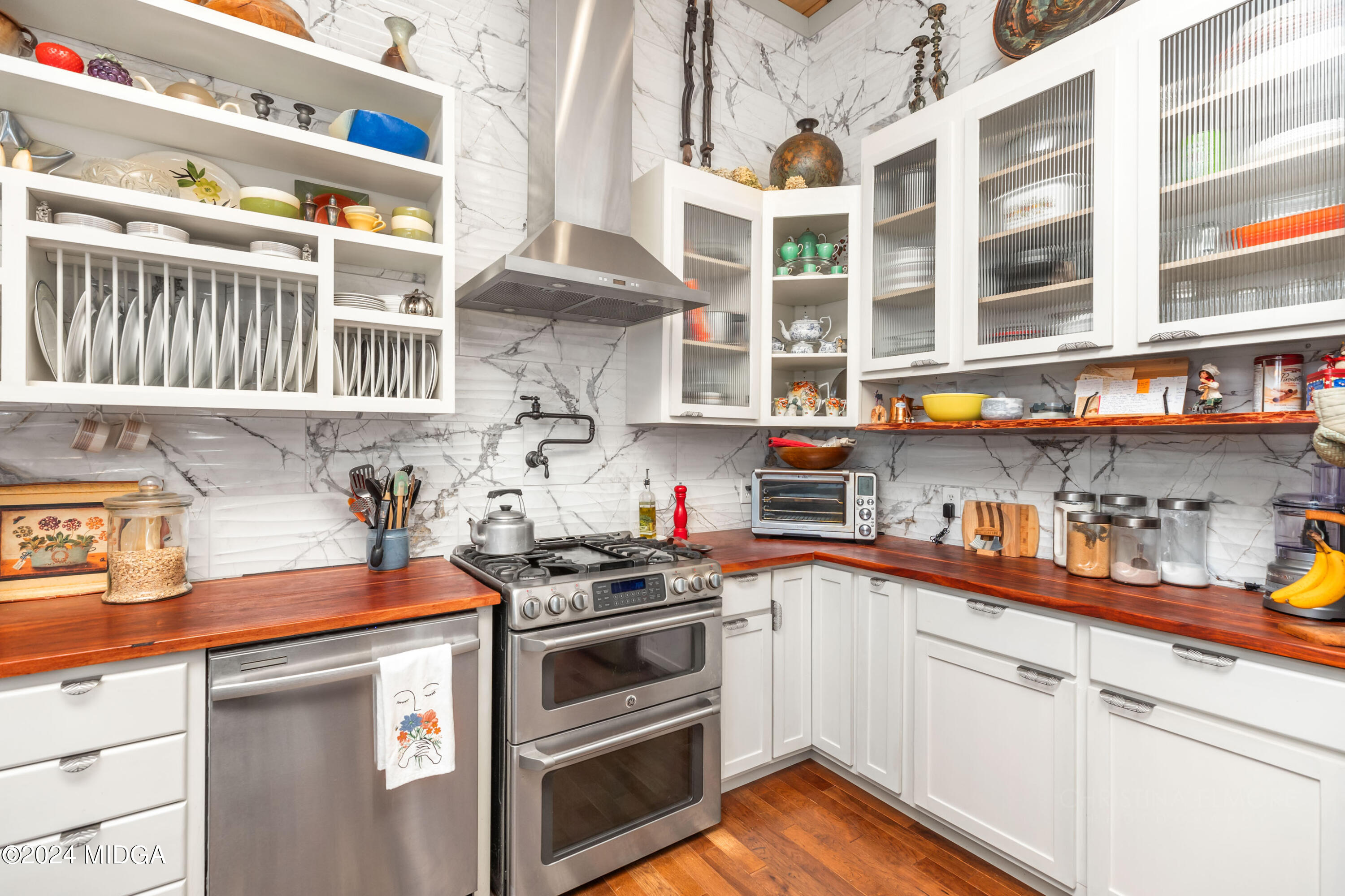 362 Stone Edge Road Macon, GA 31210 - Photo 24 of 68 a kitchen with stainless steel appliances and white cabinets