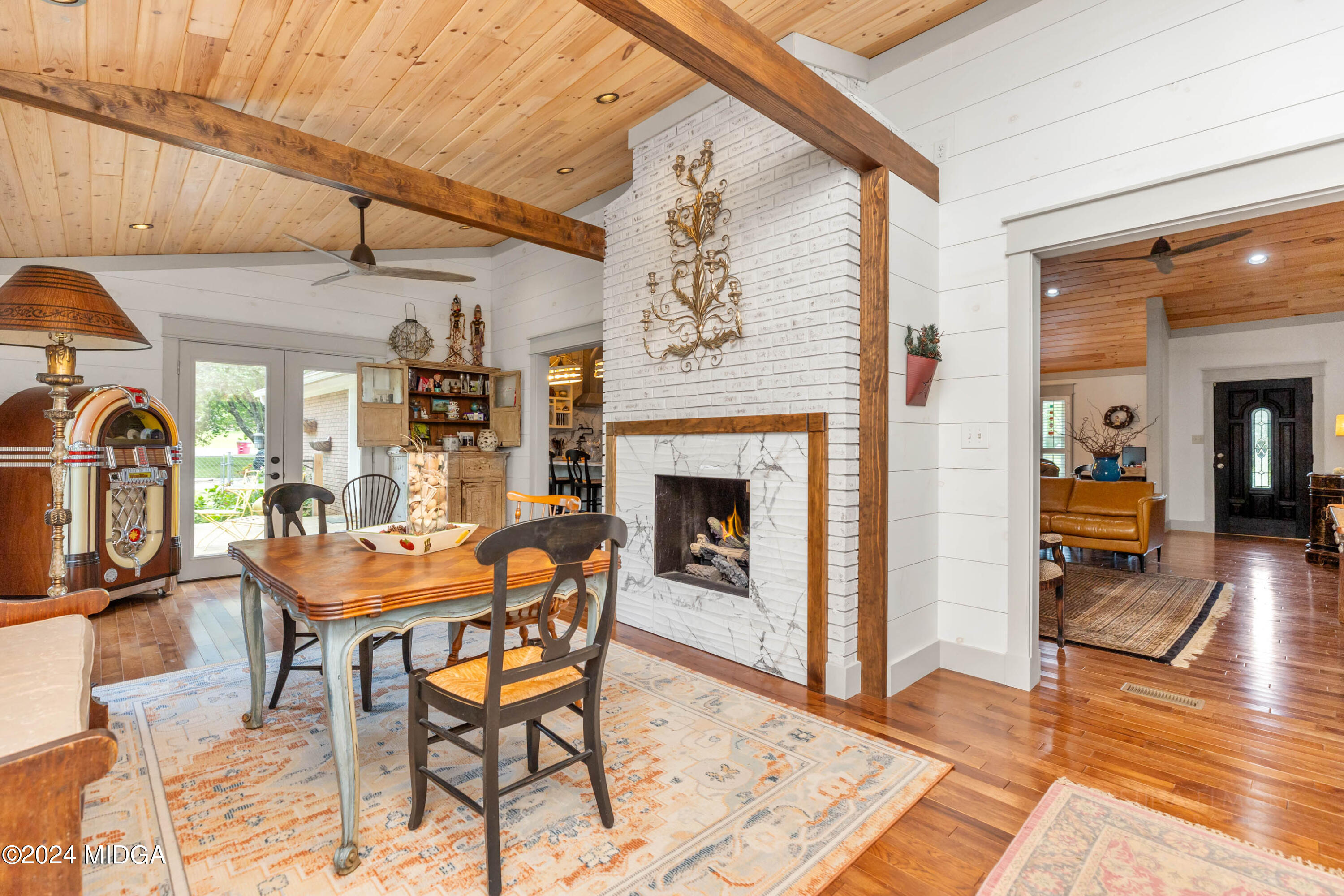 362 Stone Edge Road Macon, GA 31210 - Photo 33 of 68 a dining room with furniture and a fireplace
