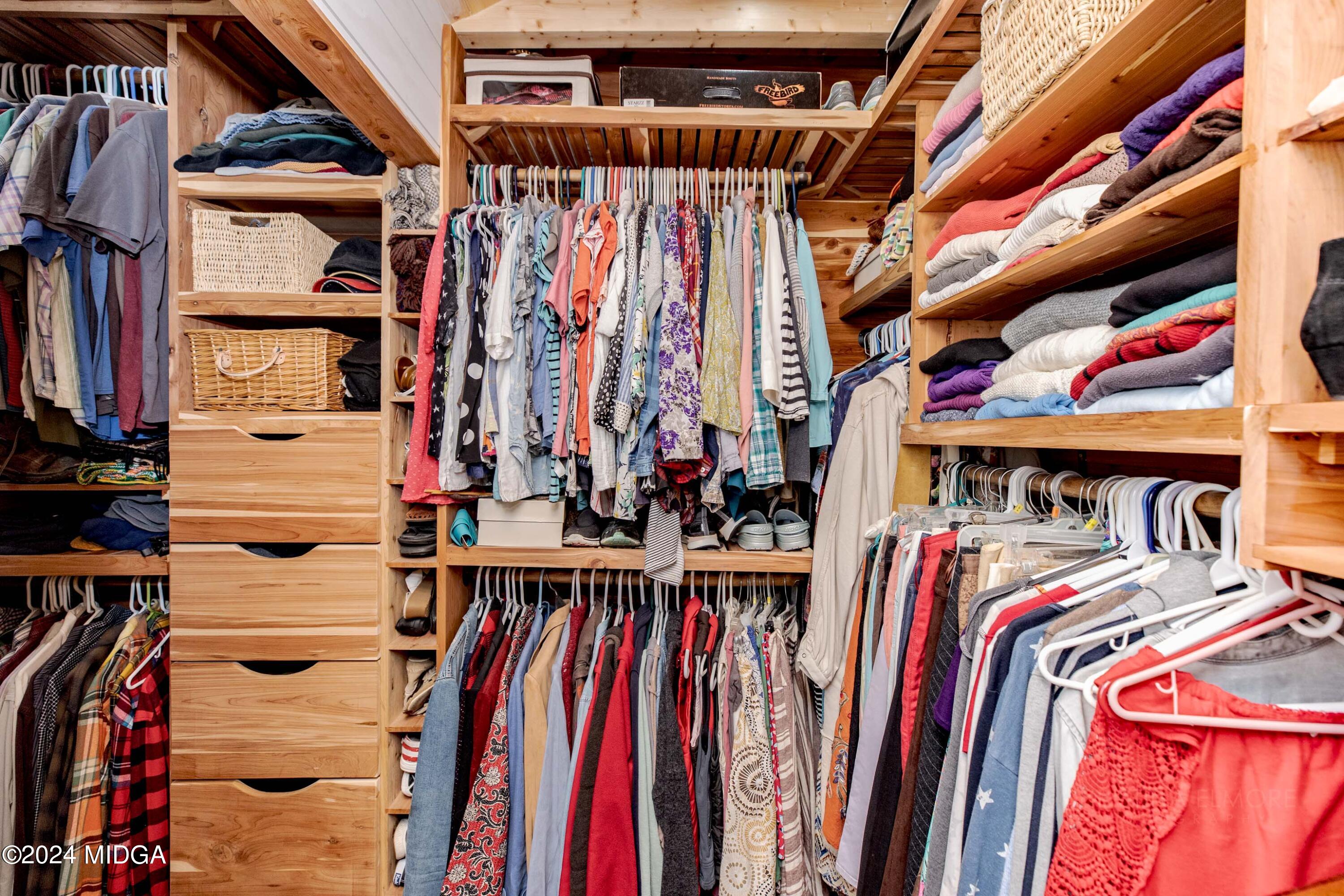 362 Stone Edge Road Macon, GA 31210 - Photo 48 of 68 a view of walk in closet with clothes and shoes