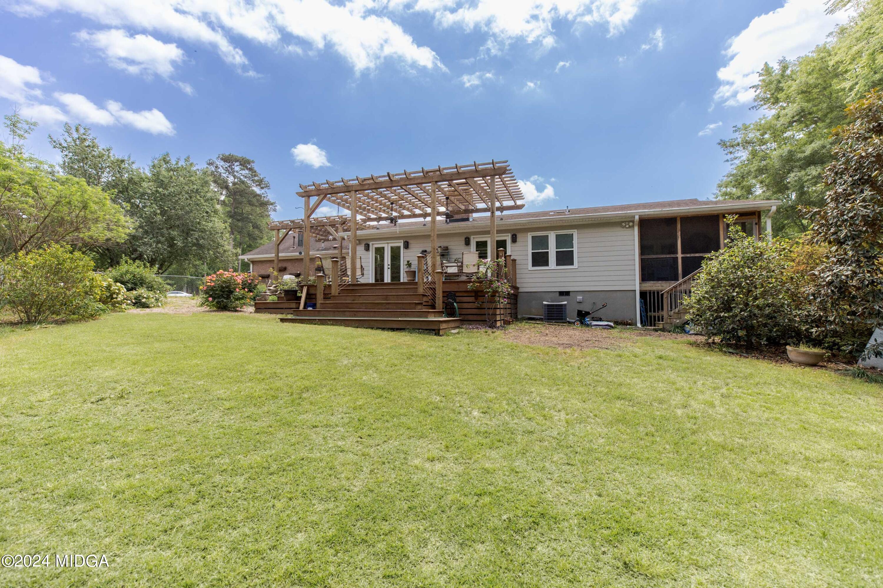 362 Stone Edge Road Macon, GA 31210 - Photo 66 of 68 a front view of a house with a garden and plants