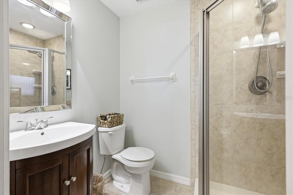 2329 River Ridge Road, Unit 2 DeLand, FL 32720 - Photo 13 of 17 a bathroom with a sink a toilet and shower