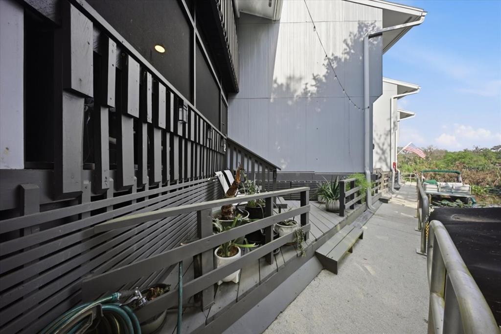 2329 River Ridge Road, Unit 2 DeLand, FL 32720 - Photo 16 of 17 a view of a balcony with chairs