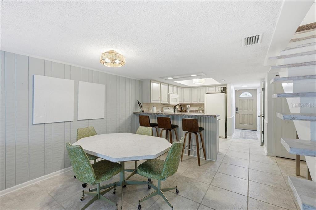 2329 River Ridge Road, Unit 2 DeLand, FL 32720 - Photo 5 of 17 a view of a dining room with furniture