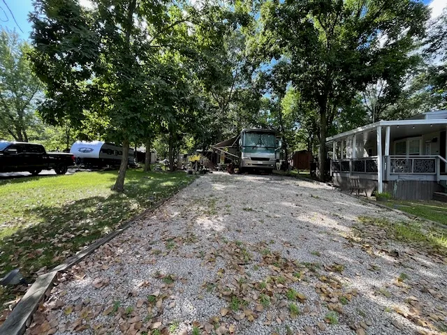 a view of a house with backyard porch and sitting area