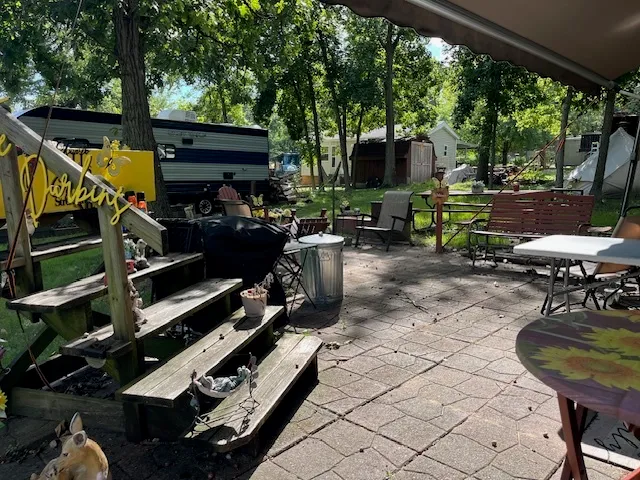 a view of a chairs and table in the patio