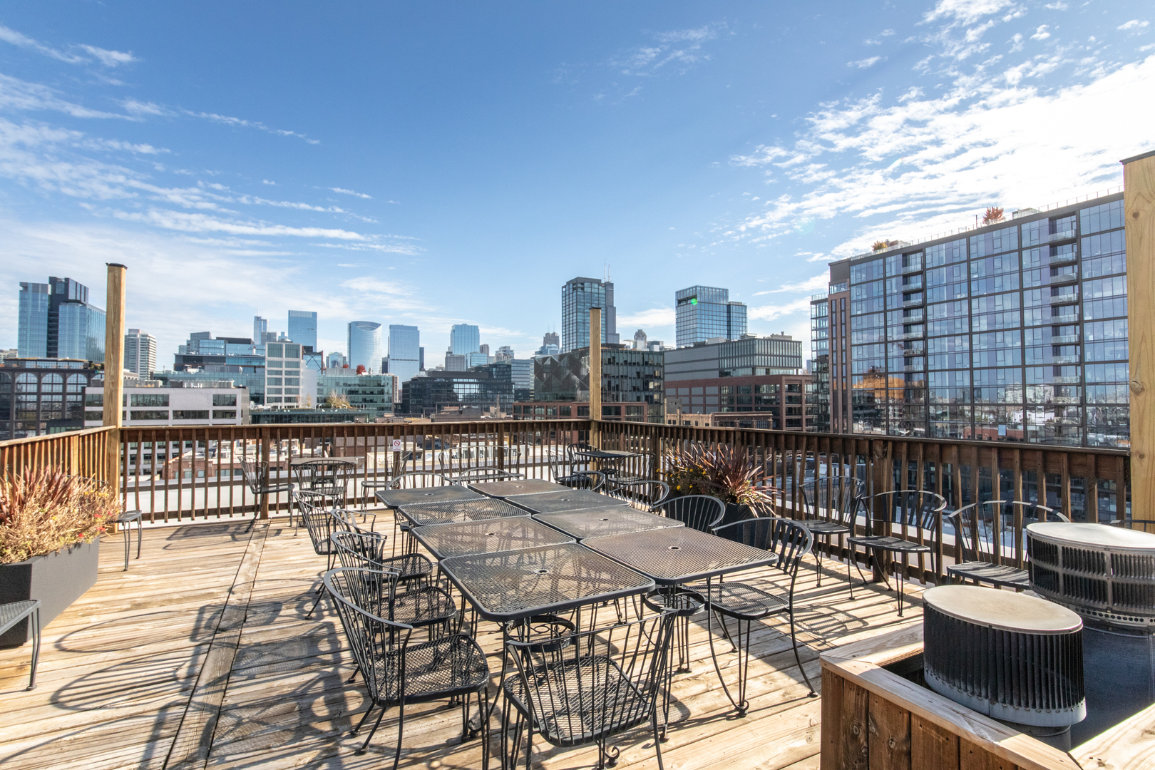 312 North May Street, Unit 4J Chicago, IL 60607 - Photo 22 of 26 a view of a roof deck with couches and wooden floor