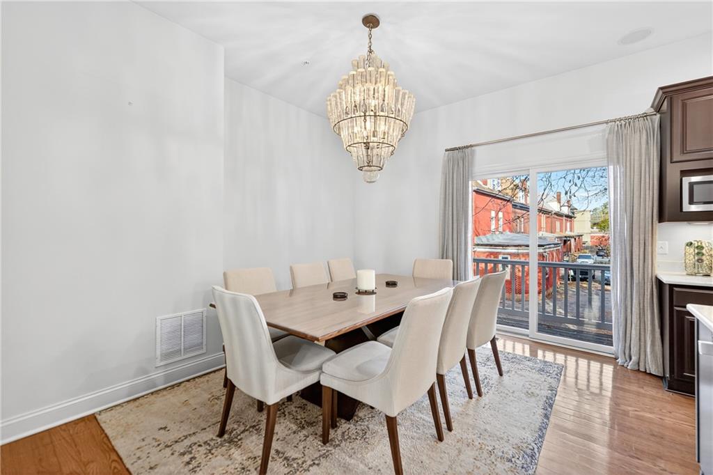 4709 Wallingford Street Pittsburgh, PA 15213 - Photo 11 of 39 a dining room with furniture a chandelier and window