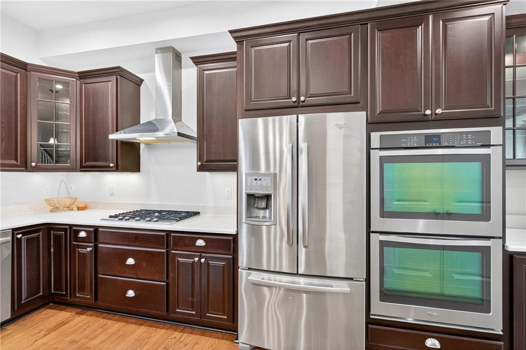 4709 Wallingford Street Pittsburgh, PA 15213 - Photo 15 of 39 a kitchen with stainless steel appliances granite countertop a refrigerator and a wooden cabinets