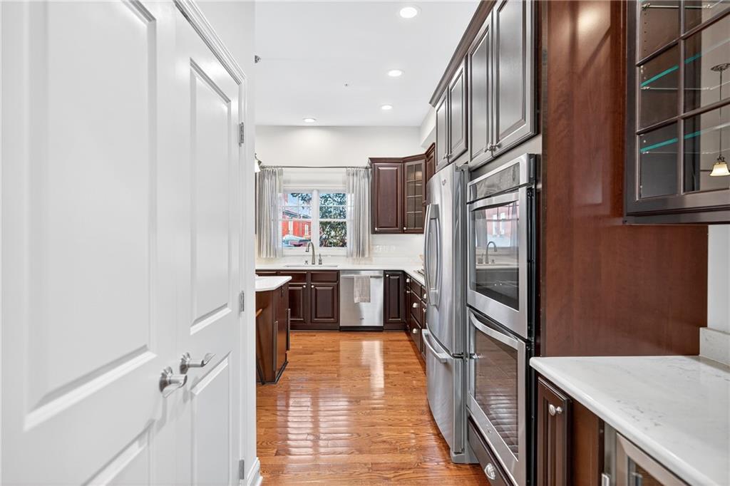 4709 Wallingford Street Pittsburgh, PA 15213 - Photo 16 of 39 a kitchen with stainless steel appliances a refrigerator and a stove