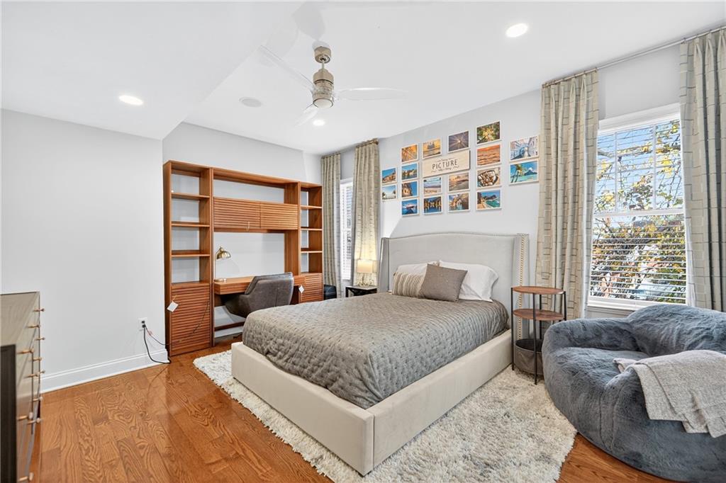 4709 Wallingford Street Pittsburgh, PA 15213 - Photo 19 of 39 a bedroom with a large bed and a large window