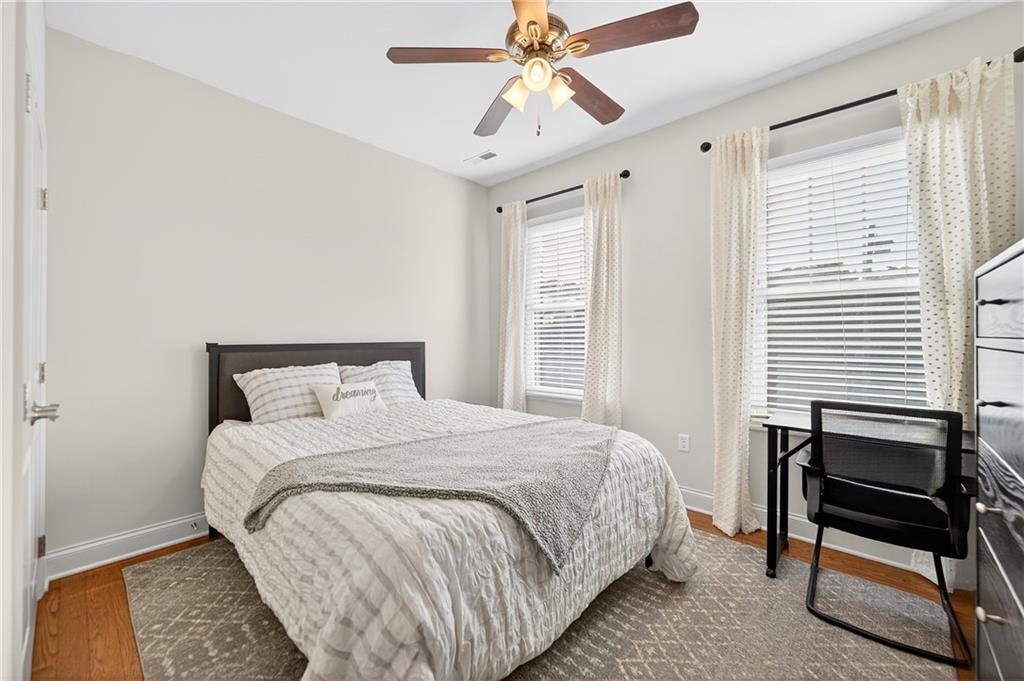 4709 Wallingford Street Pittsburgh, PA 15213 - Photo 22 of 39 a bedroom with a bed a table and chair