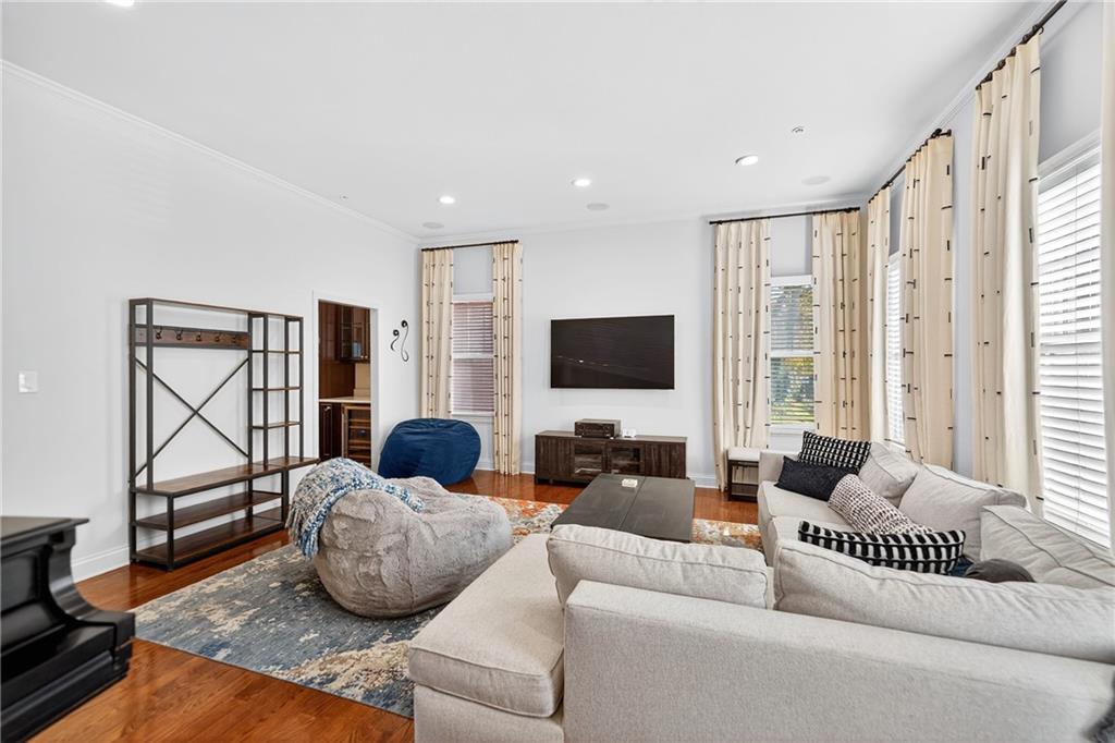 4709 Wallingford Street Pittsburgh, PA 15213 - Photo 5 of 39 a living room with furniture and a flat screen tv