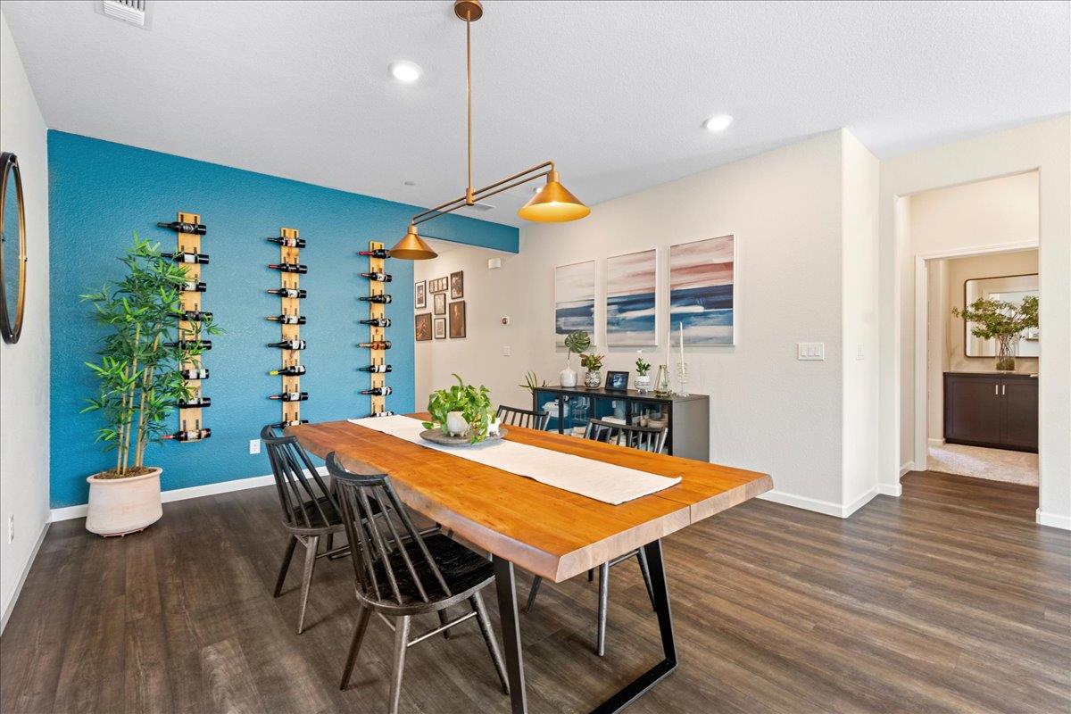 823 Riley Lane Lincoln, CA 95648 - Photo 13 of 52 a view of a dining room with furniture window and wooden floor