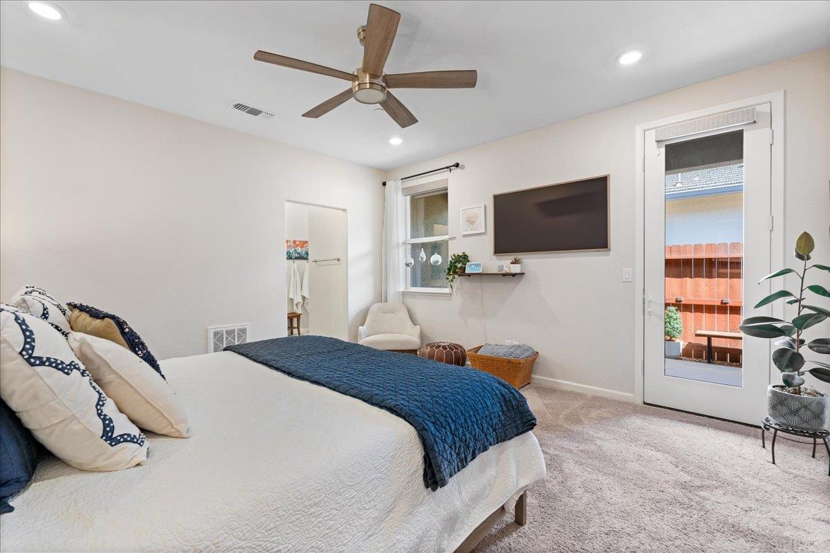 823 Riley Lane Lincoln, CA 95648 - Photo 16 of 52 a bedroom with a bed and a flat screen tv