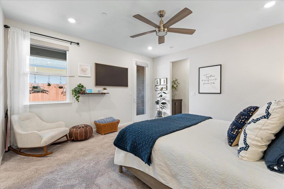 823 Riley Lane Lincoln, CA 95648 - Photo 17 of 52 a spacious bedroom with a bed and a flat screen tv