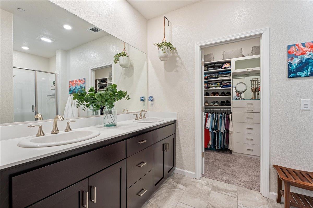 823 Riley Lane Lincoln, CA 95648 - Photo 18 of 52 a bathroom with a sink double vanity and a shower
