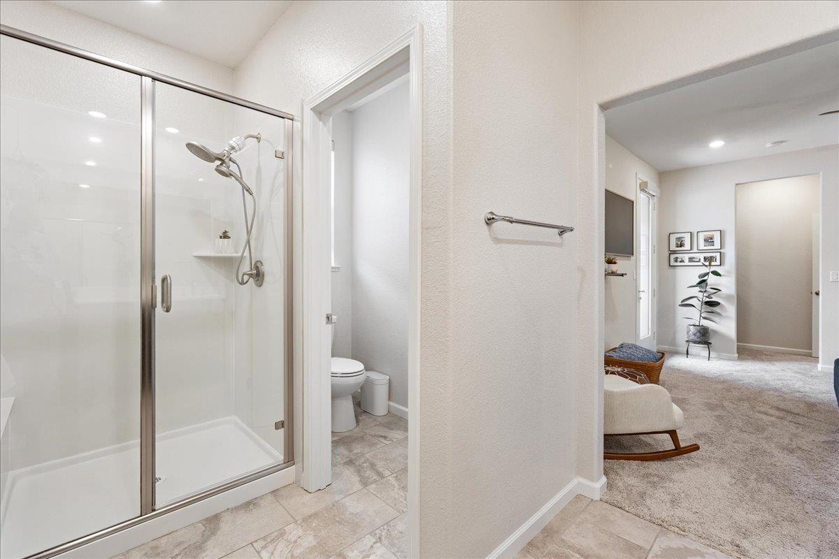 823 Riley Lane Lincoln, CA 95648 - Photo 19 of 52 a bathroom with a shower and a glass door
