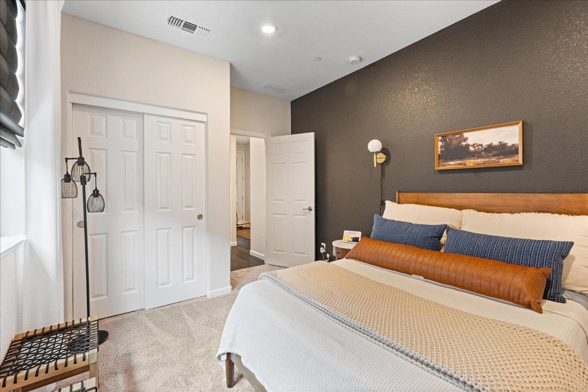 823 Riley Lane Lincoln, CA 95648 - Photo 24 of 52 a bedroom with a bed and a wall painting