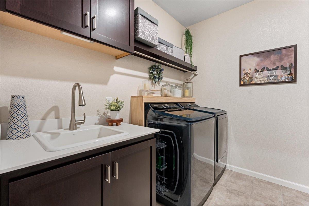 823 Riley Lane Lincoln, CA 95648 - Photo 28 of 52 a utility room with a sink and a stove top oven