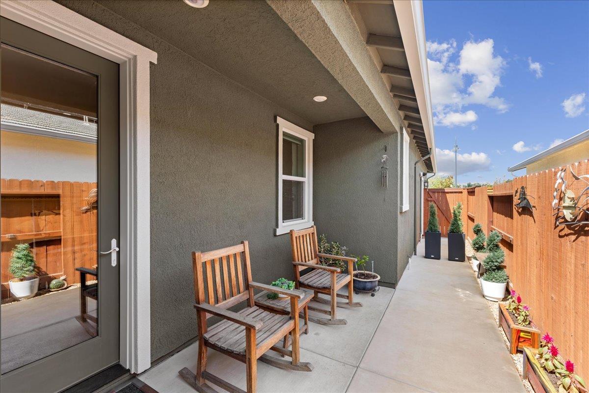 823 Riley Lane Lincoln, CA 95648 - Photo 36 of 52 a balcony with chairs and with potted plants