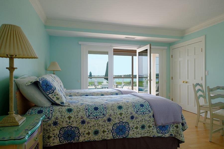 13 Pine Tree Drive Buzzards Bay, MA 02532 - Photo 14 of 30 a bed sitting in a bedroom next to a window