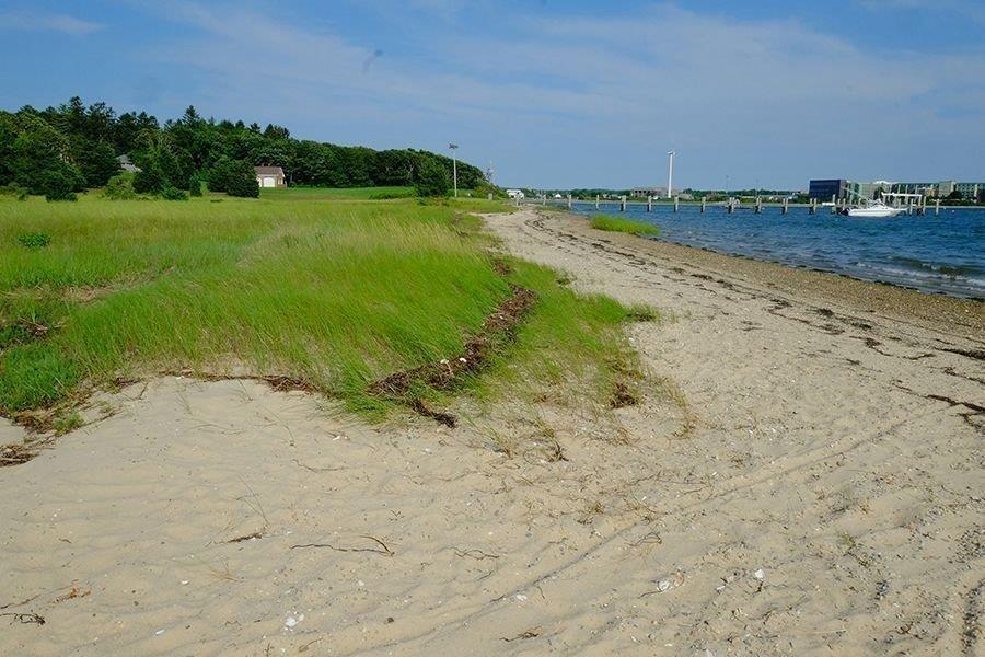 13 Pine Tree Drive Buzzards Bay, MA 02532 - Photo 22 of 30 a view of a lake with beach and green space