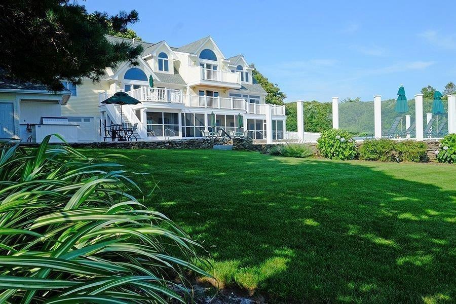 13 Pine Tree Drive Buzzards Bay, MA 02532 - Photo 24 of 30 a view of a big yard with plants and large trees